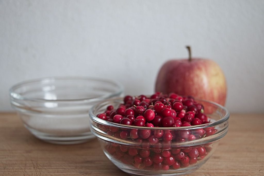 Fresh lingonberries prepared for lingonberry apple jam recipe