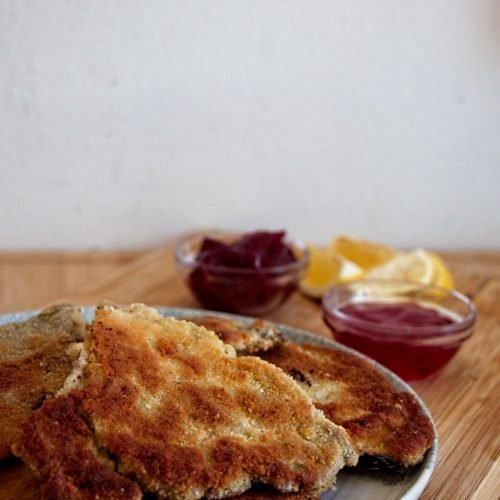Crispy breaded parasol mushrooms served with lemon wedges and cornelian cherry jelly and lingonberry jam