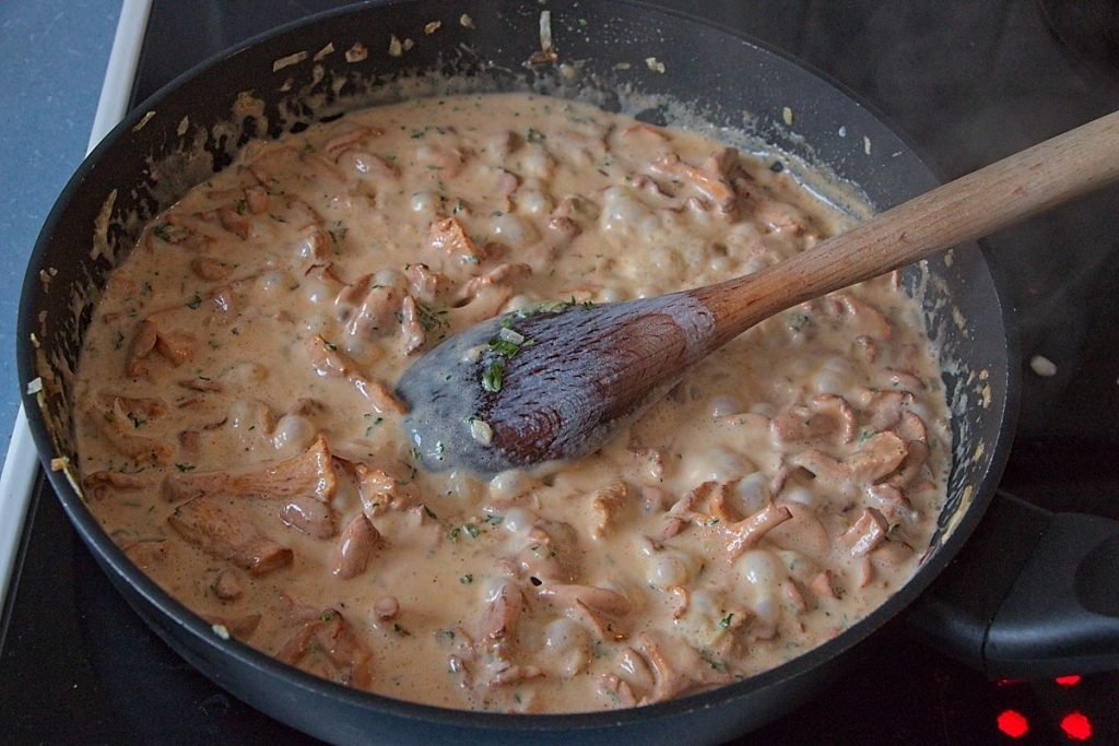 Paprika and flour stirred into chanterelles to thicken sauce