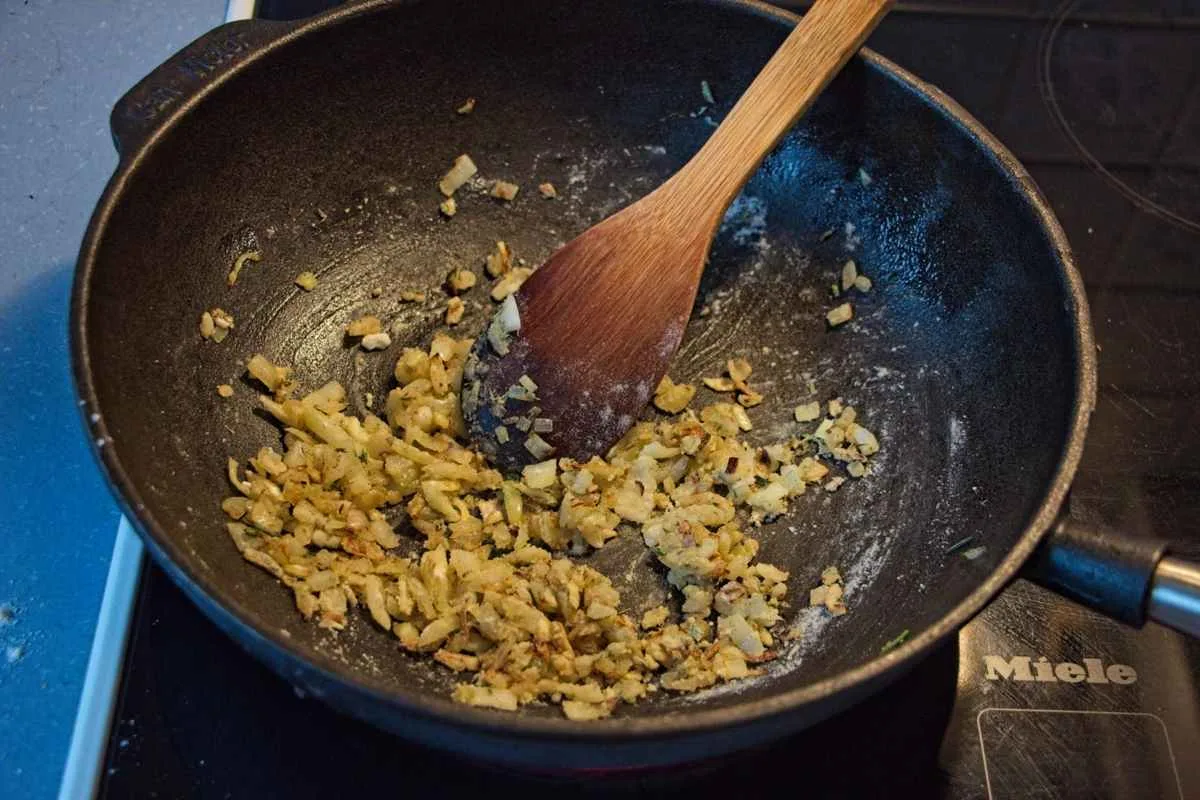 Onions, garlic, and herbs cooked with flour in a pan to form a roux.