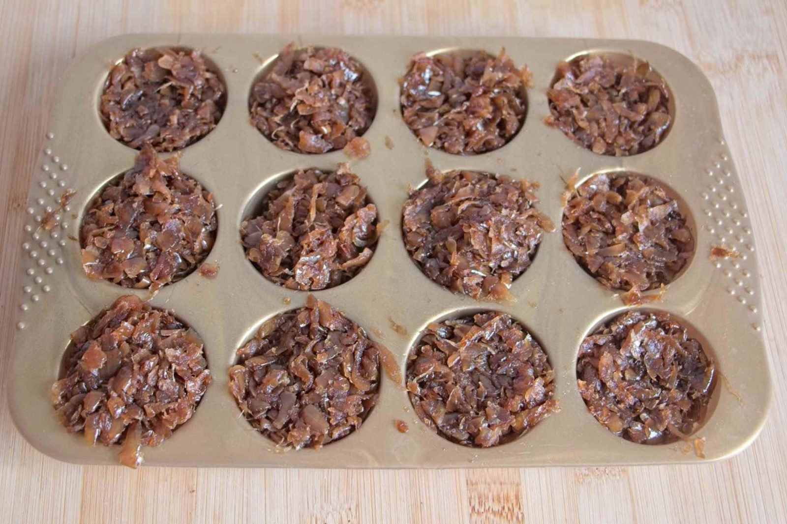 Portioned slow cooker caramelised onions frozen in a muffin tray for easy storage and later use.