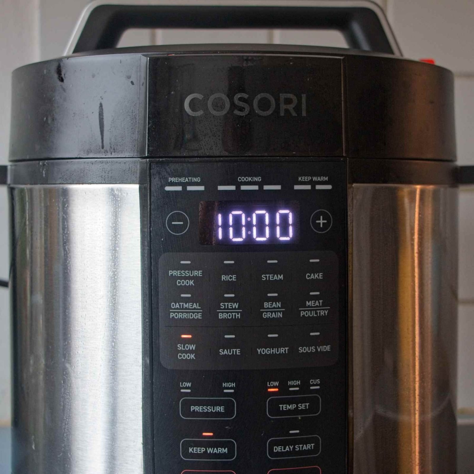 Instant Pot set to slow cook mode with a 10-hour timer before cooking the onions.