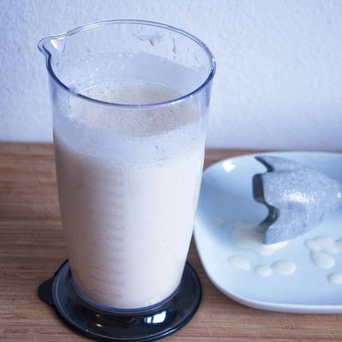 Smooth blended cheesecake filling in a jug after mixing until completely creamy
