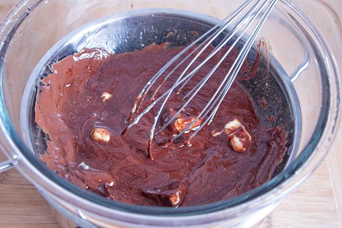 Dark chocolate and butter melting together in a glass bowl