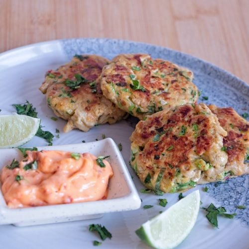 Lion’s mane mushroom “crab” cakes served with lime wedges and a simple dipping sauce.