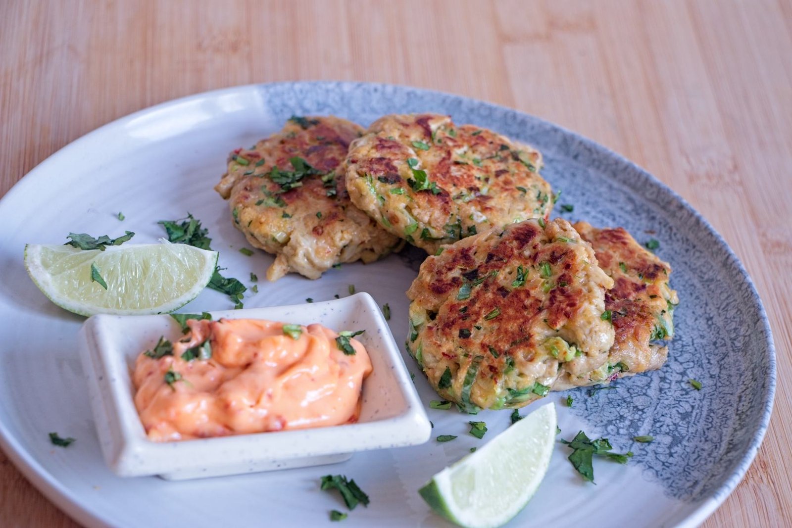 Lion’s mane mushroom “crab” cakes served with lime wedges and a simple dipping sauce.