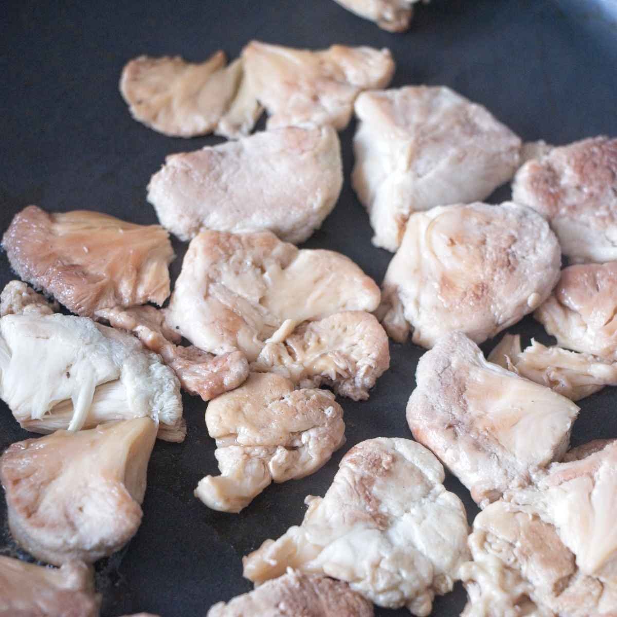 Lion’s mane mushroom pieces after dry-cooking, with most moisture cooked off