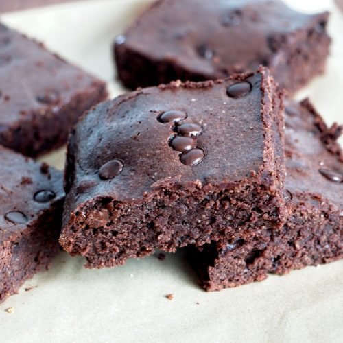 Fudgy protein brownies cut into thick squares with a dense chocolate centre.