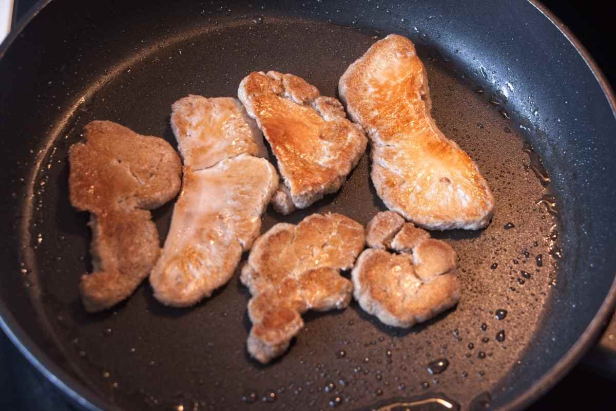 Mushrooms browning in a pan until golden on the surface during cooking