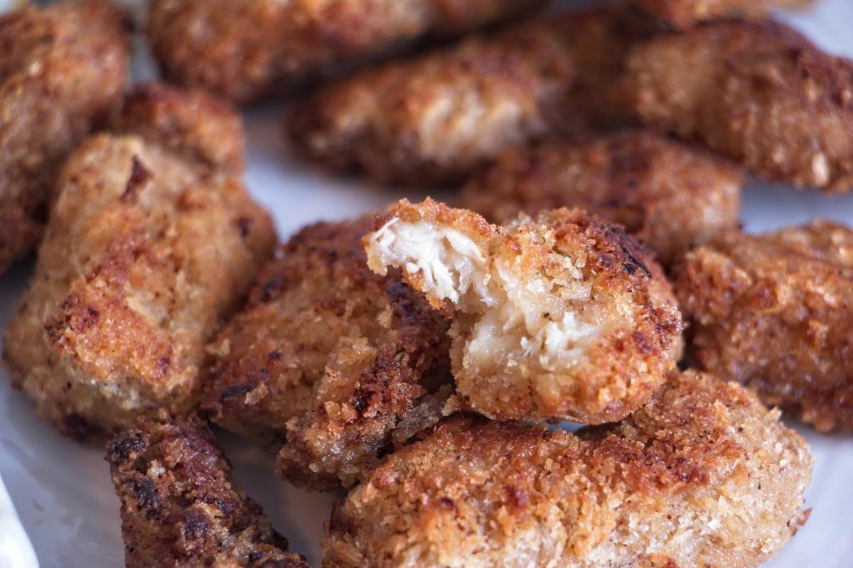 Close-up of lion’s mane mushroom nuggets showing the crisp golden coating and tender, shreddy interior.