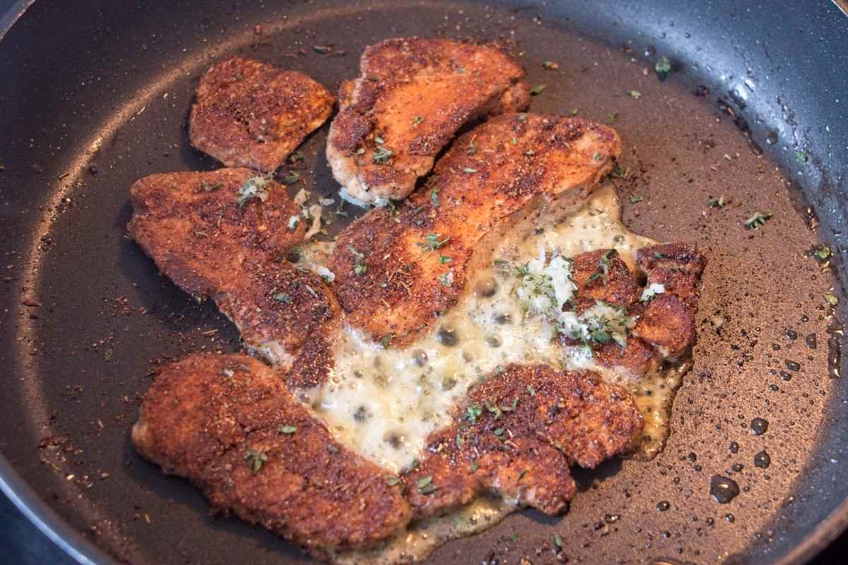 Pan-fried lion’s mane mushrooms in butter and thyme, showing how to cook lion’s mane mushrooms until deeply golden