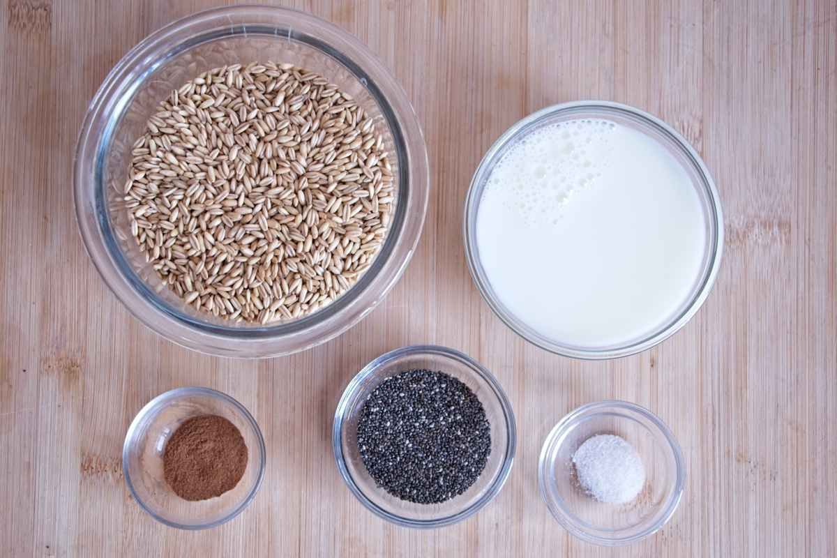 ingredients for instant pot oat groats including oat groats, milk, chia seeds, cinnamon, and salt