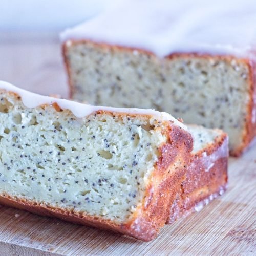 lemon poppy seed skyr cake sliced loaf with lemon glaze showing soft crumb and poppy seeds