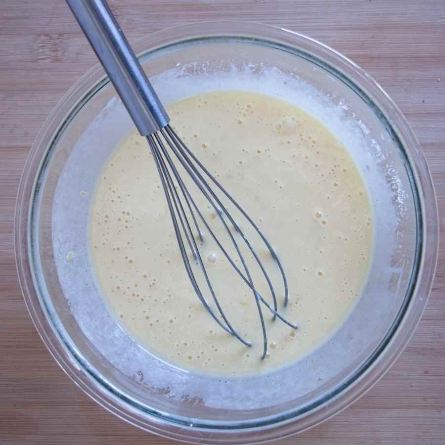 cake batter whisked until smooth in a glass mixing bowl