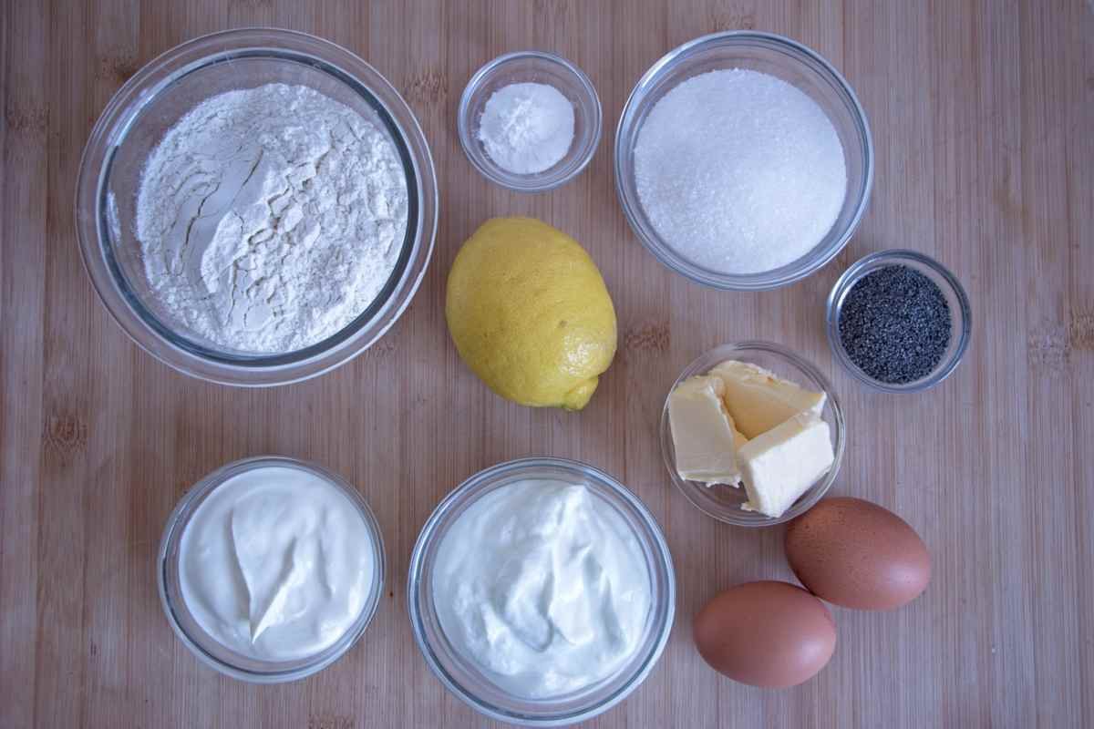 lemon poppy seed skyr cake ingredients including flour, skyr, Greek yogurt, lemon, eggs, butter, sugar, and poppy seeds