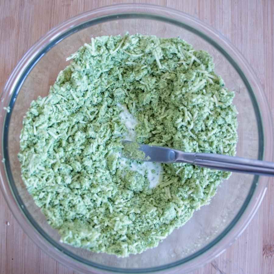 Adding milk to wild garlic scone mixture with cheese before forming the dough