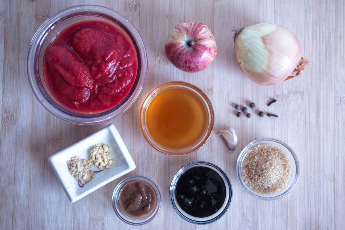Homemade brown sauce recipe ingredients including tomatoes, apple, onion, vinegar, spices and tamarind