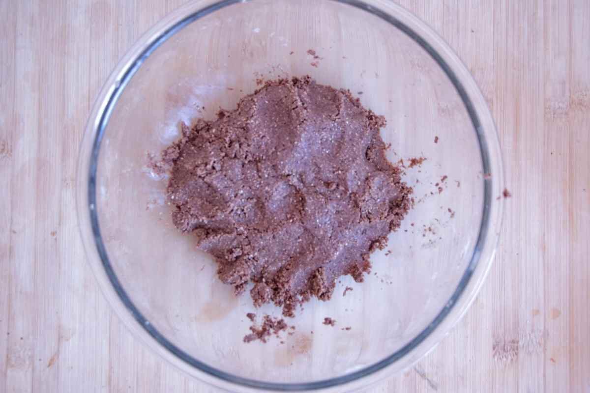 Protein bar dough mixed to a thick, crumbly consistency before pressing into the tin