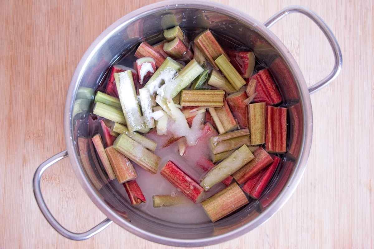 Chopped rhubarb in saucepan with sugar and water before cooking