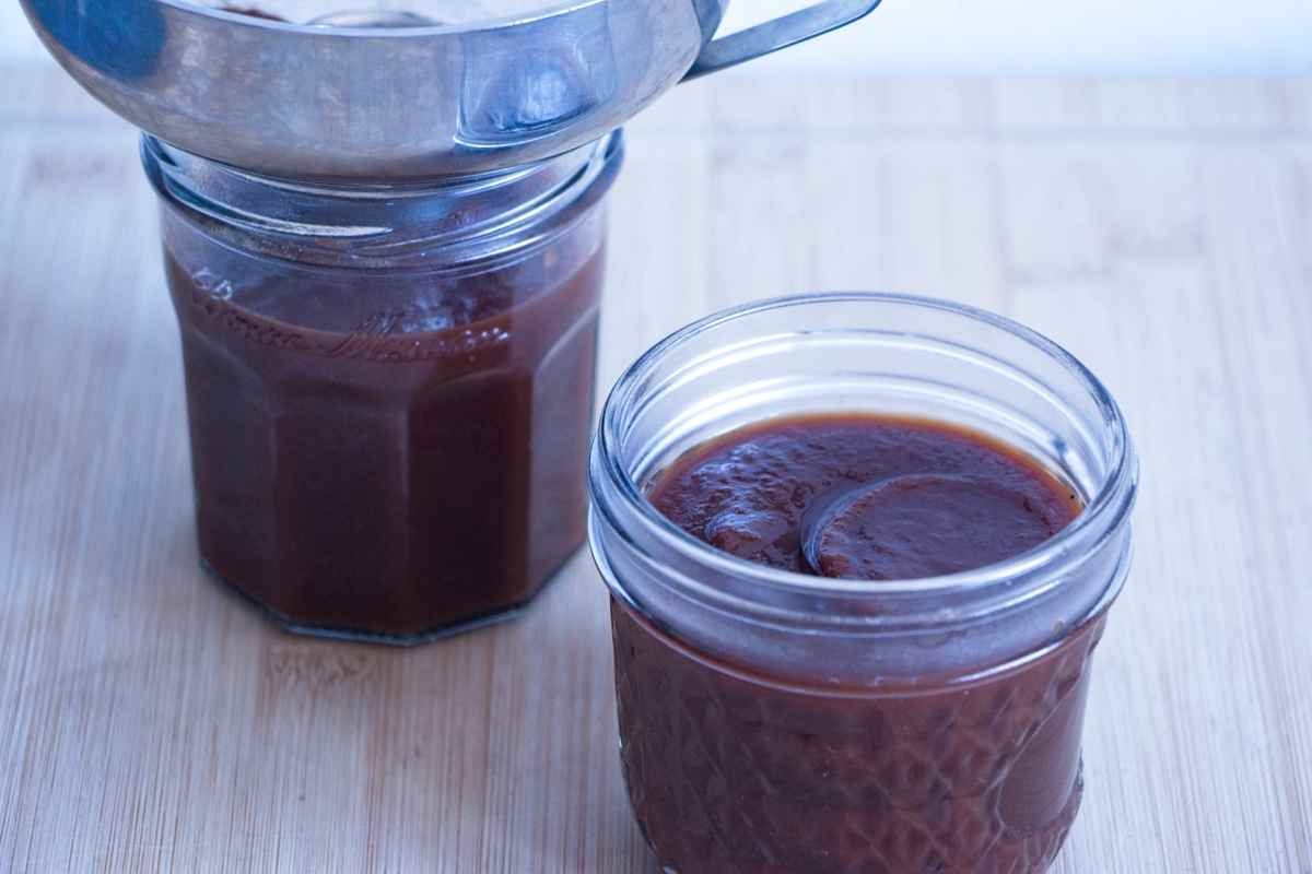 Homemade brown sauce recipe in glass jars, showing smooth, thick texture after cooking