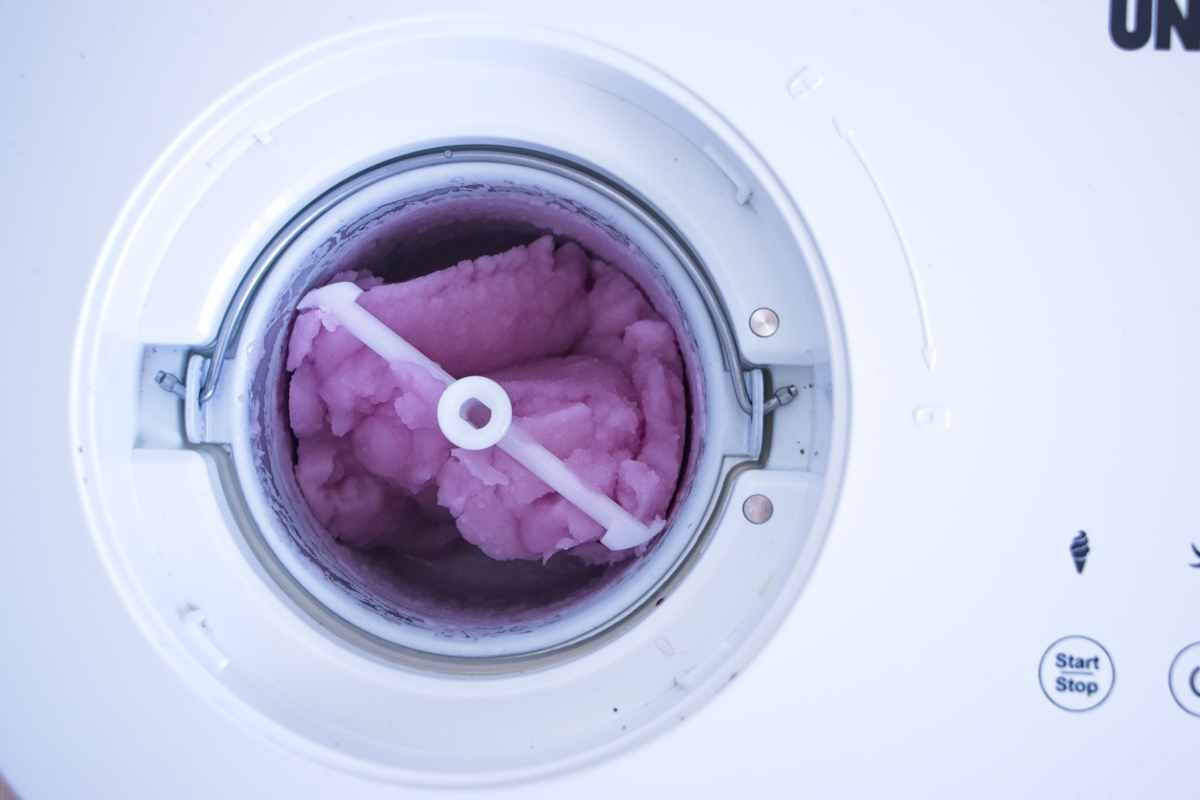 violet sorbet churning in ice cream machine showing soft texture forming
