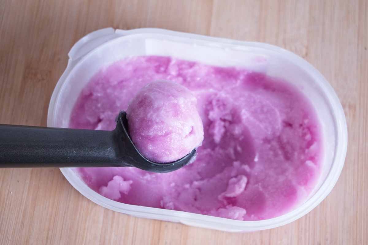 violet sorbet recipe showing texture while scooping from container