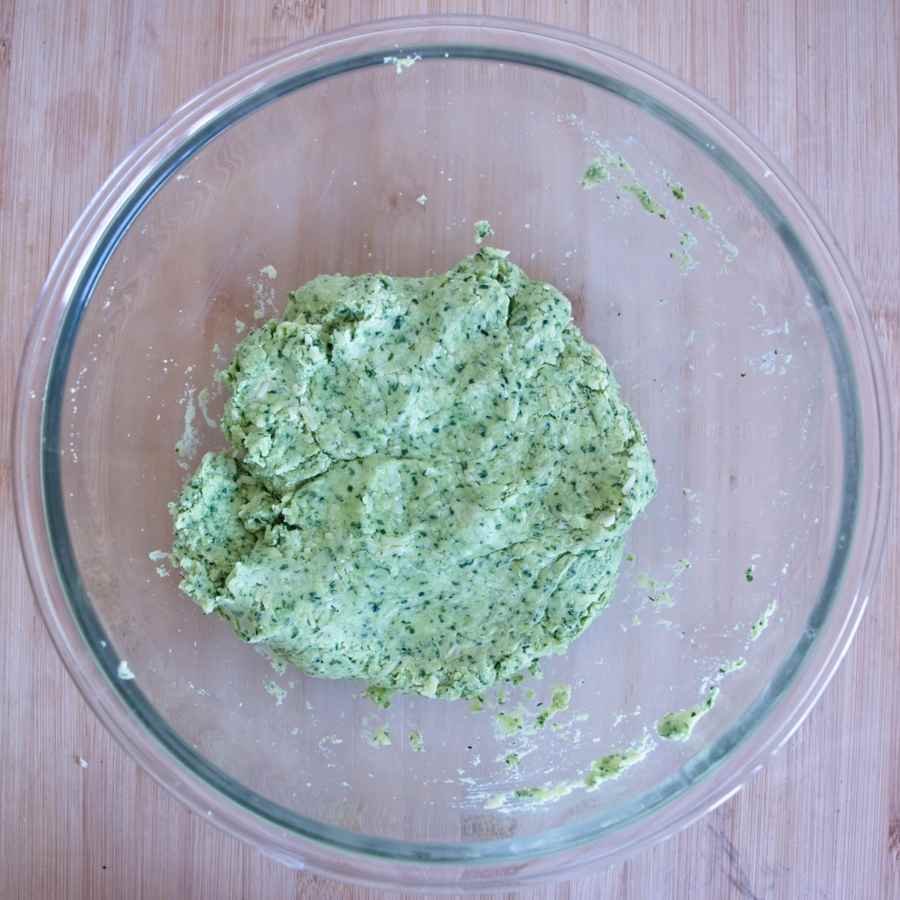 Wild garlic scone dough in a bowl, showing soft green mixture ready to shape