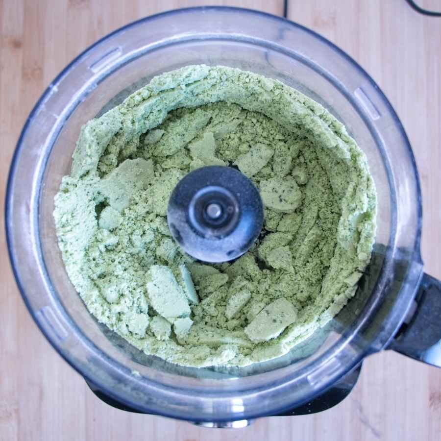Wild garlic cheese scones dough after rubbing butter into flour, showing coarse crumb texture in a food processor