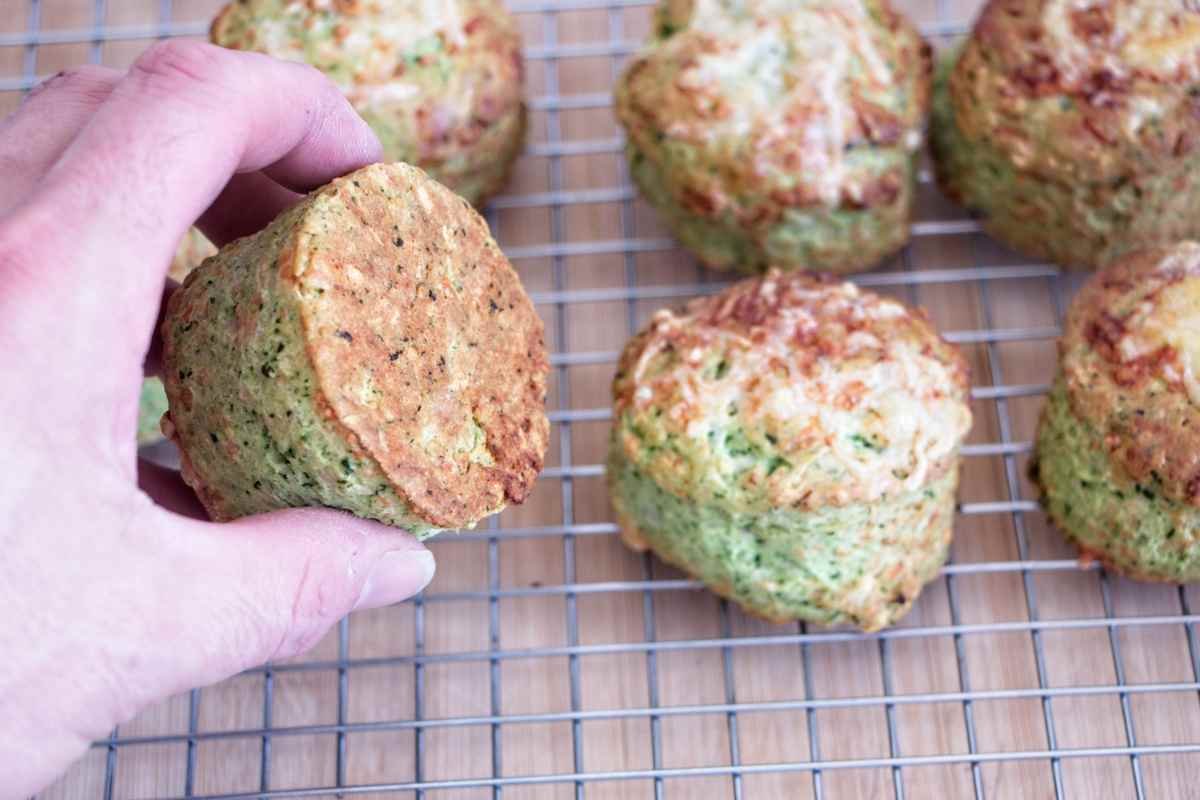 Underside of wild garlic cheese scones showing golden baked base on a cooling rack