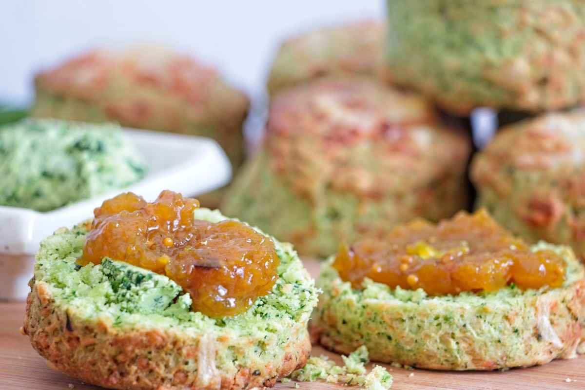 Wild garlic cheese scones served with chutney on top, showing the green interior and crumb texture
