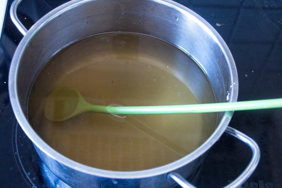 dandelion flower liquid cooking in saucepan