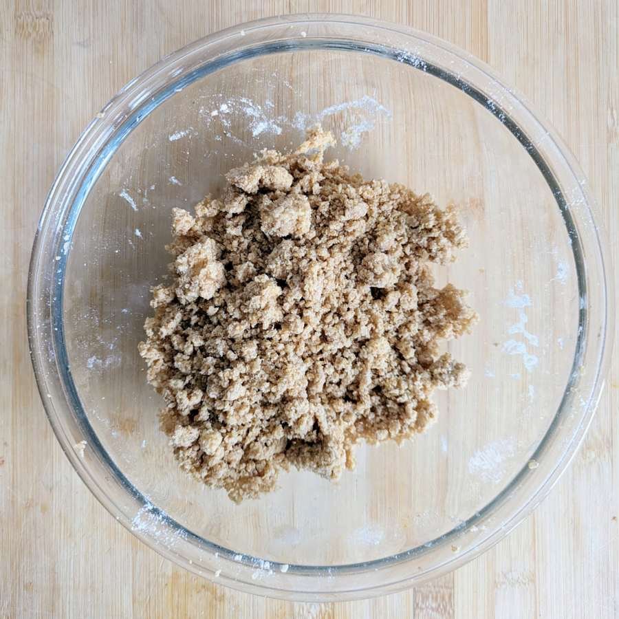 Cinnamon streusel topping with a mixture of fine crumbs and larger buttery clumps.