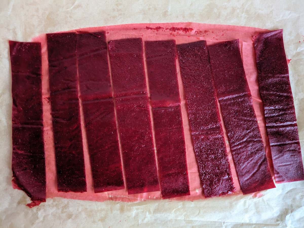 Cornelian cherry fruit leather cut into strips before rolling.