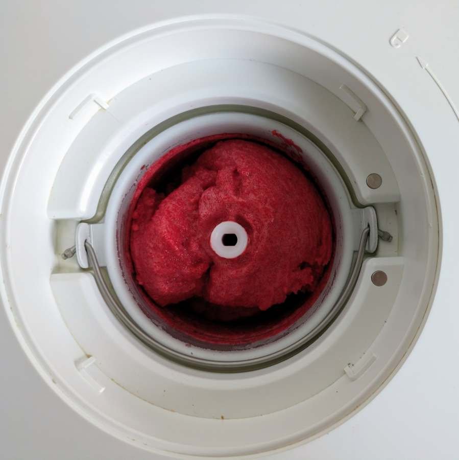 Cornelian cherry sorbet churned to a thick, smooth texture in an ice cream maker.