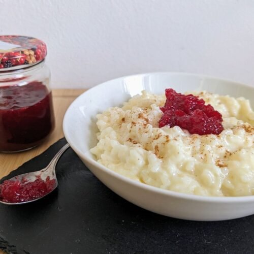 Instant Pot rice pudding served with cinnamon and Cornelian cherry jam.