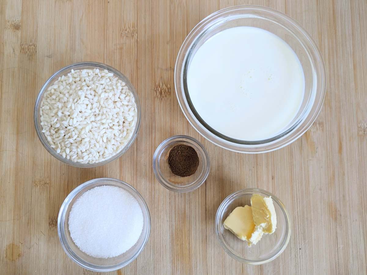 Ingredients for Instant Pot rice pudding: pudding rice, milk, sugar, butter and vanilla.