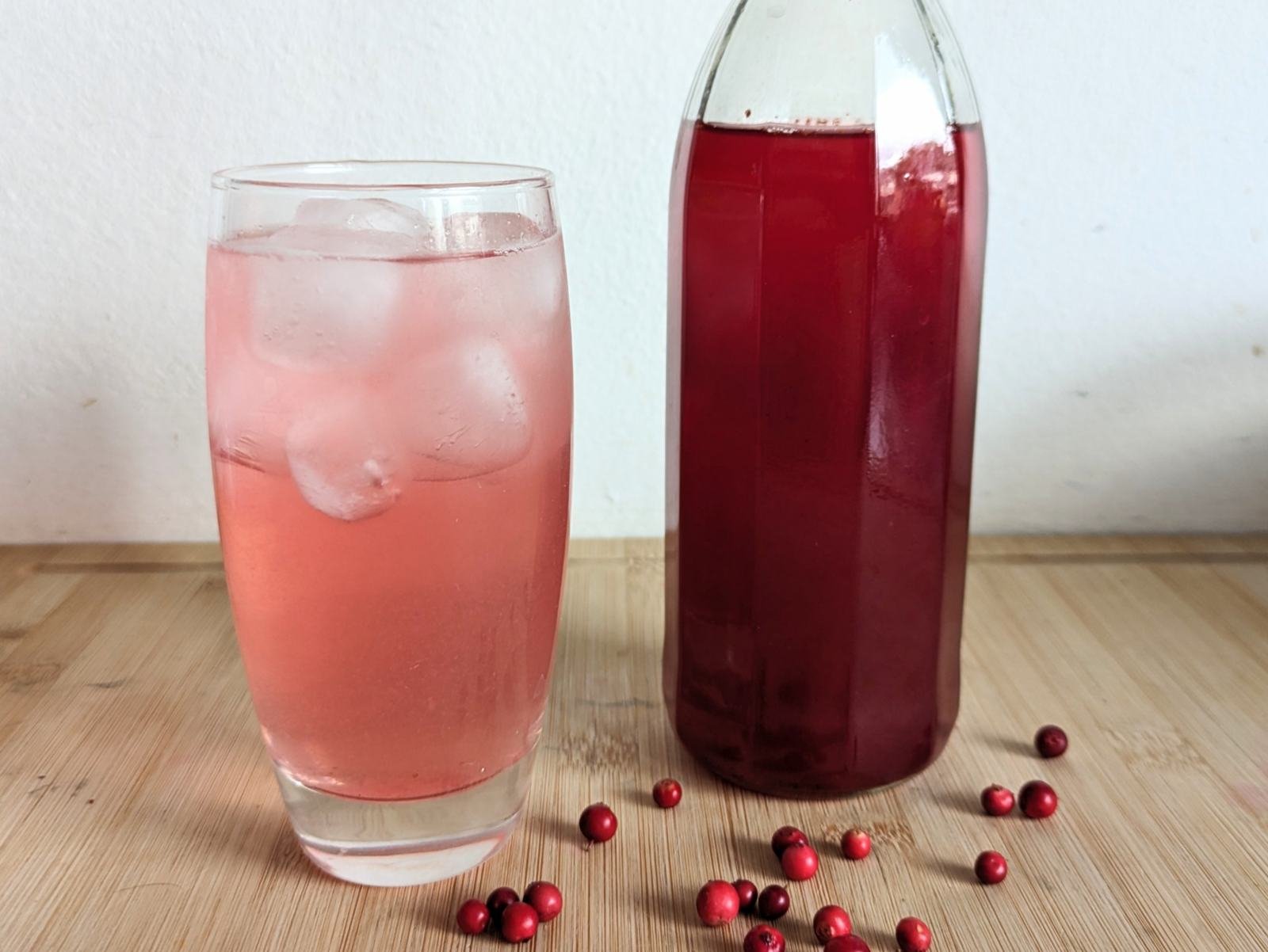 Bottle of homemade lingonberry syrup