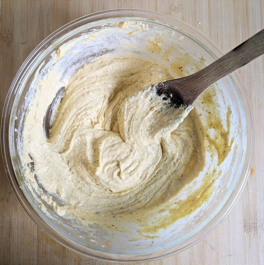 Thick almond cake batter mixed and ready to spread into the baking tin.